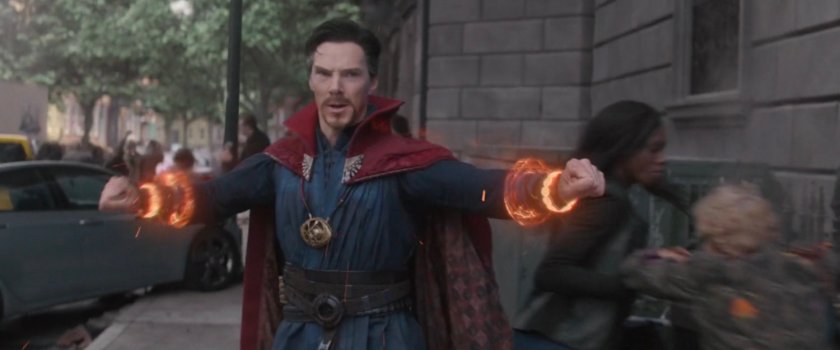 Doctor Strange powering up for a fight on a street corner.