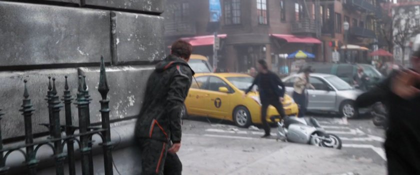 Tony Stark peaking around a street corner.