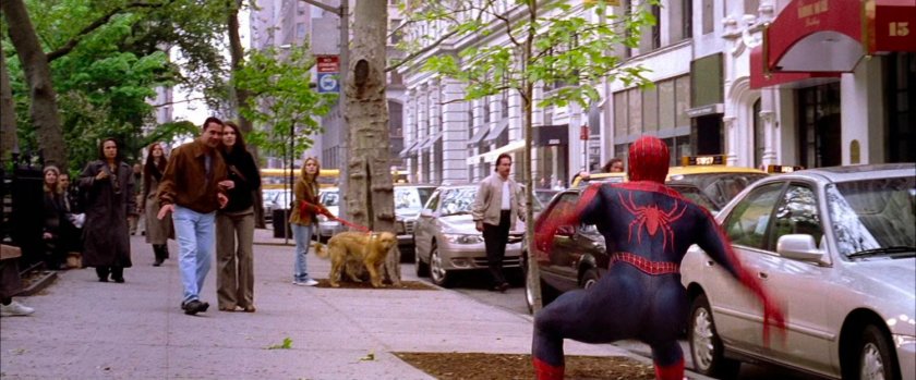 Spider-Man on sidewalk.
