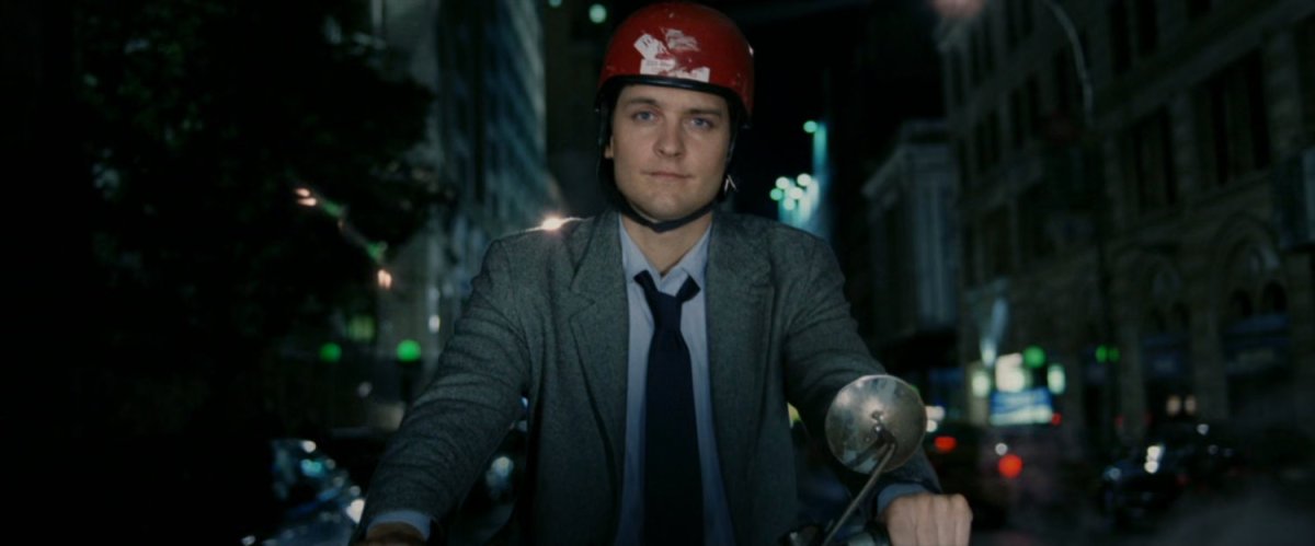 Peter Parker on Moped at night.